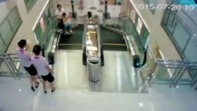Man watches wife die in China escalator accident