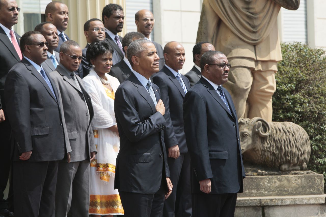 Obama and Desalegn review an honor guard at the National Palace on July 27.
