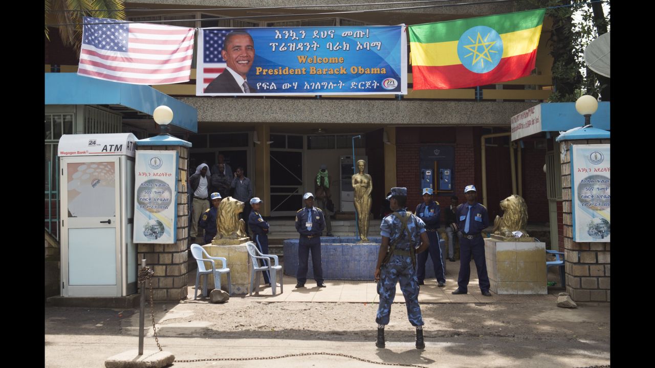 Security stands guard as Obama's motorcade drives to the National Palace in Addis Ababa on July 27.