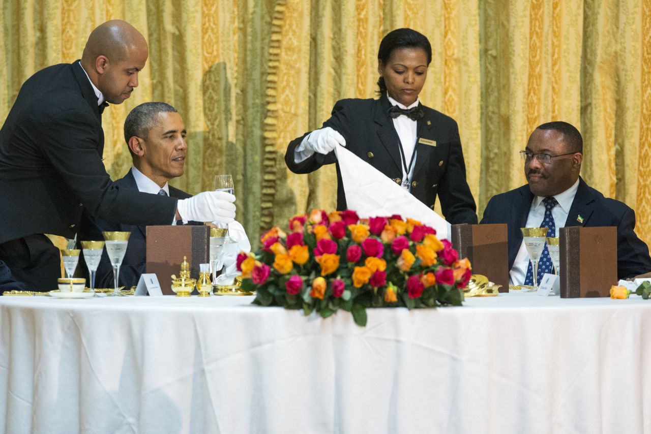 Obama and Ethiopian Prime Minister Hailemariam Desalegn are waited on during a state dinner Monday, July 27, at the National Palace in Addis Ababa.