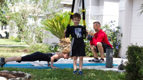 Think you don't have time to exercise? Try involving the whole family. If you have a driveway, sidewalk, small playground or park, you have enough space. Click through the gallery for a sample workout with Dana Santas, her husband, Donovan, and 6-year-old son, Luke.
