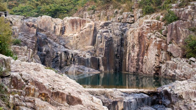 Located in Sai Kung, Sheung Luk stream flows into four pools. The largest (pictured) is a popular swimming and rock-jumping spot in summer.