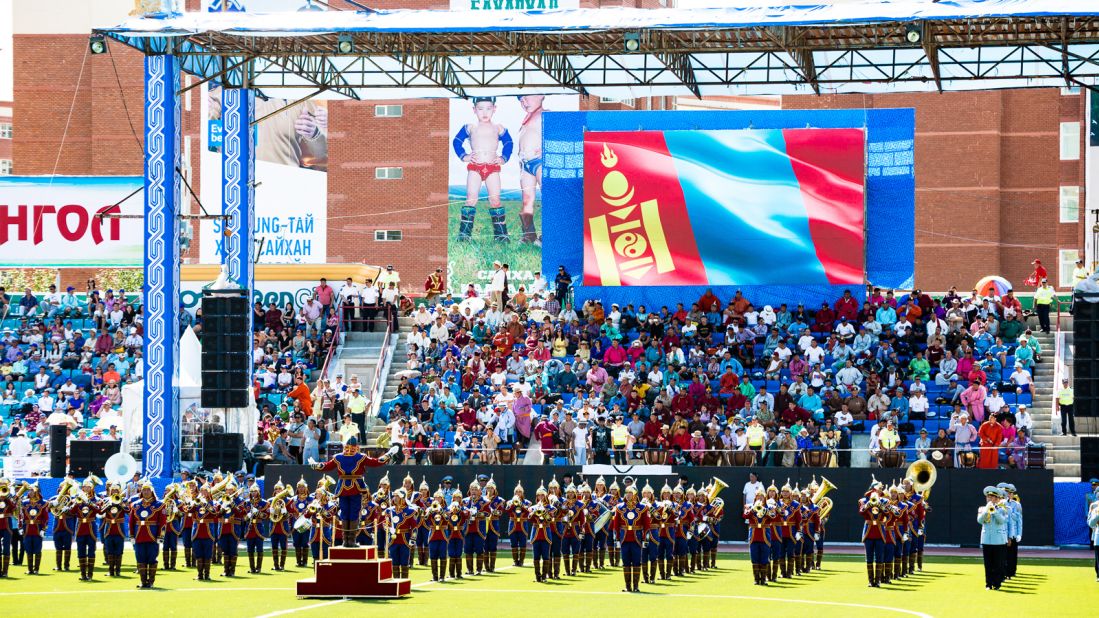 The Naadam opening ceremony is a dazzling display of traditional costumes and cultural performances, including elaborate marches performed by soldiers and music by monks.