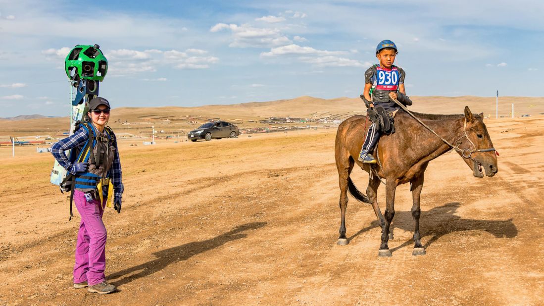 Google Street View has arrived in Mongolia, dispatching its portable Trekker to capture the annual Naadam Festival. Trekker operator Ariantuul (pictured) has climbed Mongolia's 1,600-meter Khar Zurkh Uul mountain with the 18-kilogram (40 pounds) contraption strapped on her back.