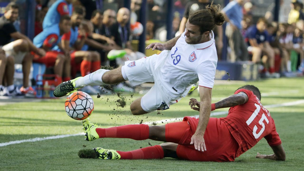 Panama's Erick Davis, bottom, tackles American Graham Zusi during the Gold Cup third-place match, which was played in Chester, Pennsylvania, on Saturday, July 25. Panama won on penalties.