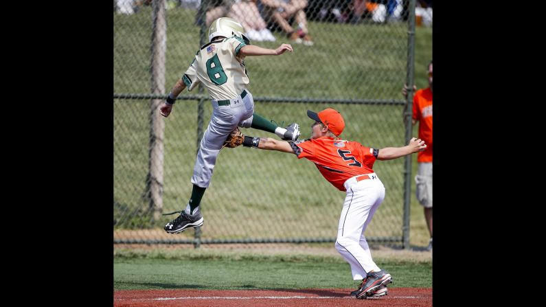 Austin Carr tags Grayson Nichols during a youth baseball game played Sunday, July 26, in Aberdeen, Maryland. The game was part of the Cal Ripken World Series.