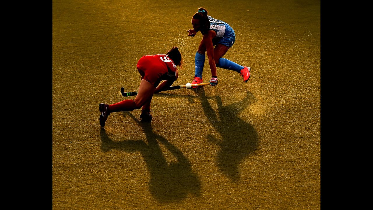 Argentina's Florencia Habif, top, blocks the shot of American Michelle Vittese during the Pan American Games' field hockey final on Friday, July 24. The United States won 2-1.