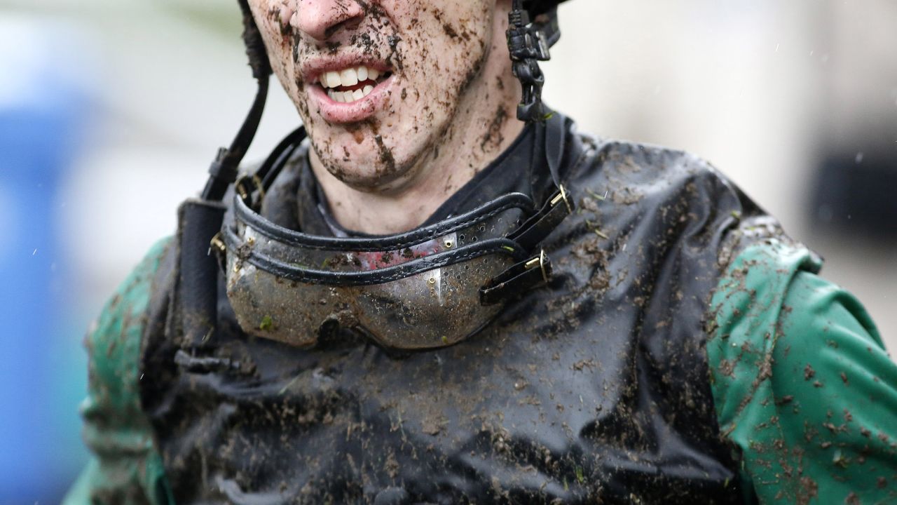 Mud is caked on jockey George Baker during an event in Ascot, England, on Friday, July 24.