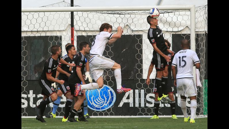 D.C. United midfielder Davy Arnaud clears the ball away from his goal during a Major League Soccer match in Washington on Saturday, July 26.