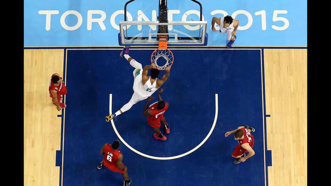 Brazil center Augusto Lima dunks the ball against Canada in the final of the Pan American Games on Saturday, July 25. Brazil won 86-71.