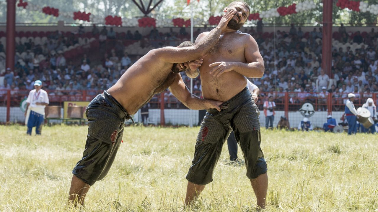 Orhan Okulu, left, and Fatij Atli compete in the 654th annual Kirkpinar Oil Wrestling Festival in Edirne, Turkey, on Sunday, July 26. It's the oldest sanctioned sporting competition in the world.