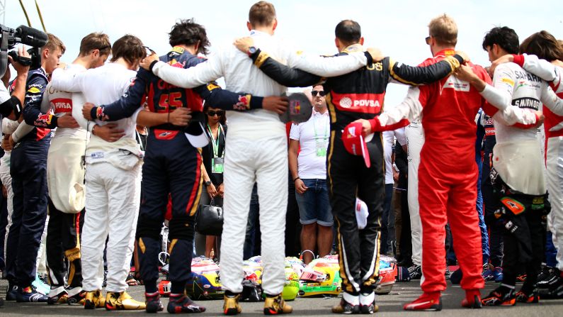Formula One drivers and members of Jules Bianchi's family observe a moment of silence for Bianchi before the Grand Prix of Hungary on Sunday, July 26. Bianchi, an F1 racer from France, <a href="index.php?page=&url=http%3A%2F%2Fwww.cnn.com%2F2015%2F07%2F18%2Fmotorsport%2Fformula-one-jules-bianchi-dies%2F" target="_blank">died July 17</a> from the head injuries he suffered nine months ago in the Japanese Grand Prix. Bianchi was 25.