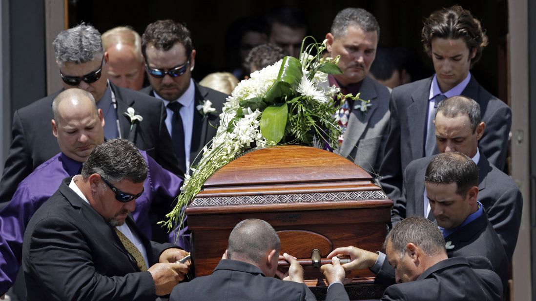 The casket of Mayci Breaux is carried out of the church after her funeral. 