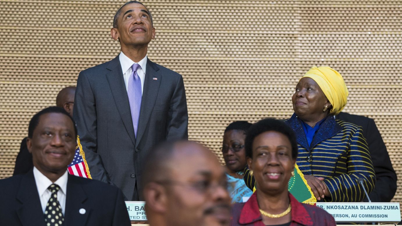 Dr. Nkosazana Dlamini-Zuma, right, chairwoman of the African Union Commission, stands with Obama as he looks up at the crowd before delivering a speech to the African Union on July 28.