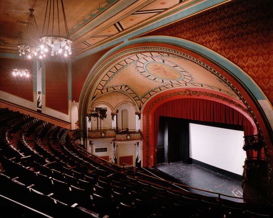 This theater, built in 1914, was designed primarily for stage performances, opera and films, which were relatively new at the time. <br />Now it shows the very latest film releases and special film series, including classics such as Boogie Nights and Jaws. <br />What are these old school cinemas like when the films are over? "It's very contemplative," says Klavens. <br />"I work with long exposures in the theaters interiors -- I don't add any lights -- and sometimes it is quite dark, and details come out that are not even visible to me."