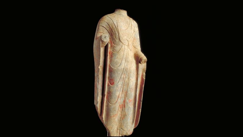 This elegant limestone figure of Buddha clad in delicately carved cloth is likely to have been surrounded with other sculptures illustrating his life. <br /><br />"It shows him renouncing worldly wealth and wearing an ascetic pauper's robe," says McCullough. "You are trying to follow his path so his life stories are very important. Like Christianity, paintings and sculptures teach illiterate people about religion. They aren't reading about it."