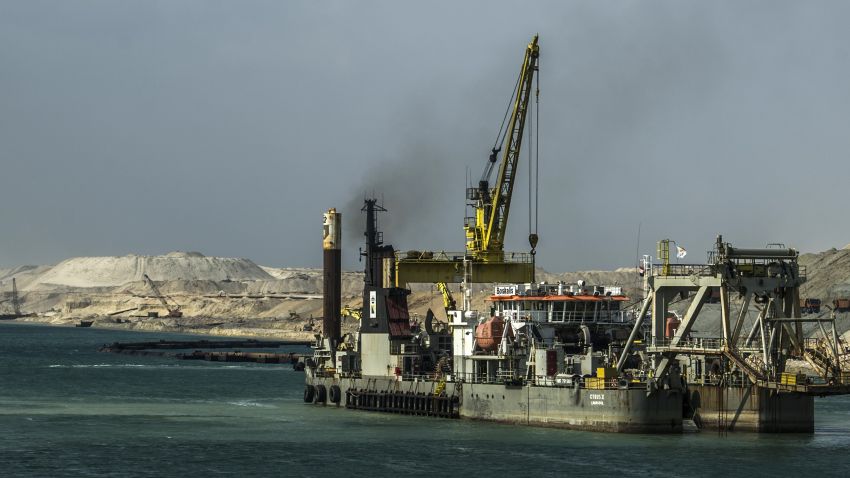 A dredger is seen at work on the new waterway of the Suez canal on June 13, 2015, in the port city of Ismailia, east of the capital Cairo.