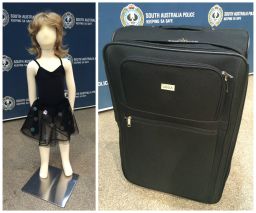 South Australia police display a similar dress and suitcase to ones found near the unidentified girl's body.