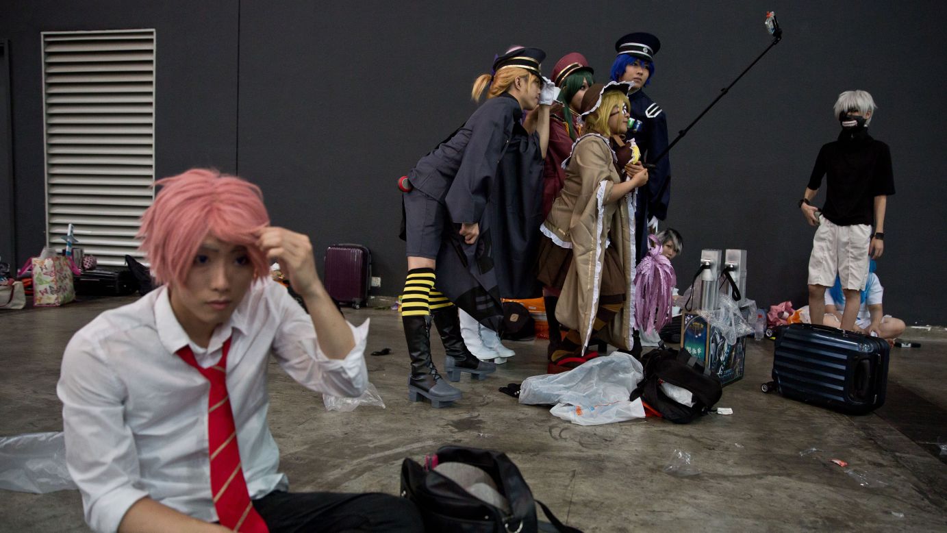 Cosplayers pose for a selfie Thursday, July 26, during the Ani-Com and Games exhibition in Hong Kong.