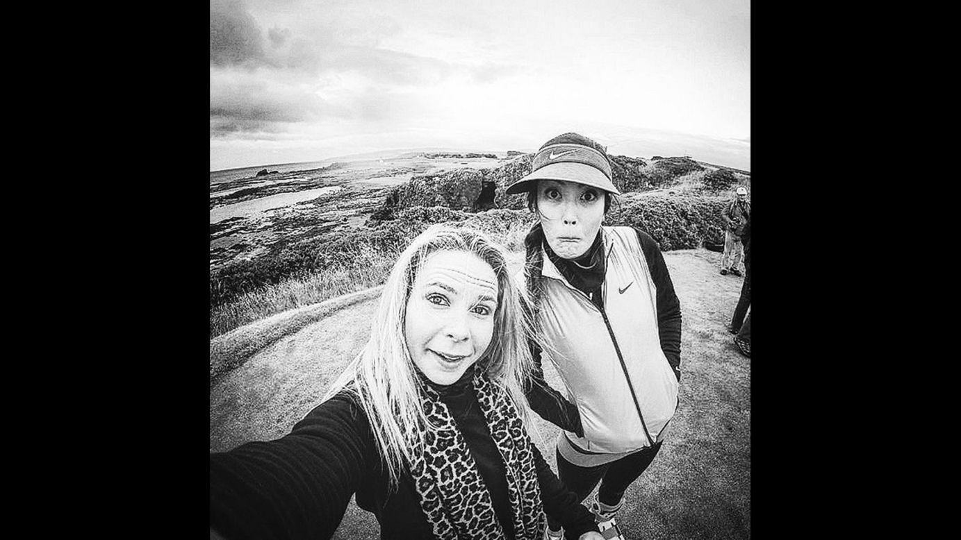 Pro golfer Michelle Wie, right, takes a photo with manager Jamie Kuhn while in Scotland for the Women's British Open. "Brrrrr," <a href="https://instagram.com/p/5rx33kp-uu/" target="_blank" target="_blank">Wie said on Instagram</a> on Tuesday, July 28.