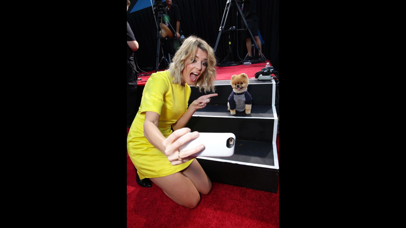 Comedian Grace Helbig takes a selfie with Jiff, <a href="http://www.guinnessworldrecords.com/news/2014/8/video-introducing-jiff-the-fastest-dog-on-two-paws-59860/" target="_blank" target="_blank">the fastest dog on two paws</a>, at the Los Angeles premiere of "Smosh: The Movie" on Wednesday, July 22.