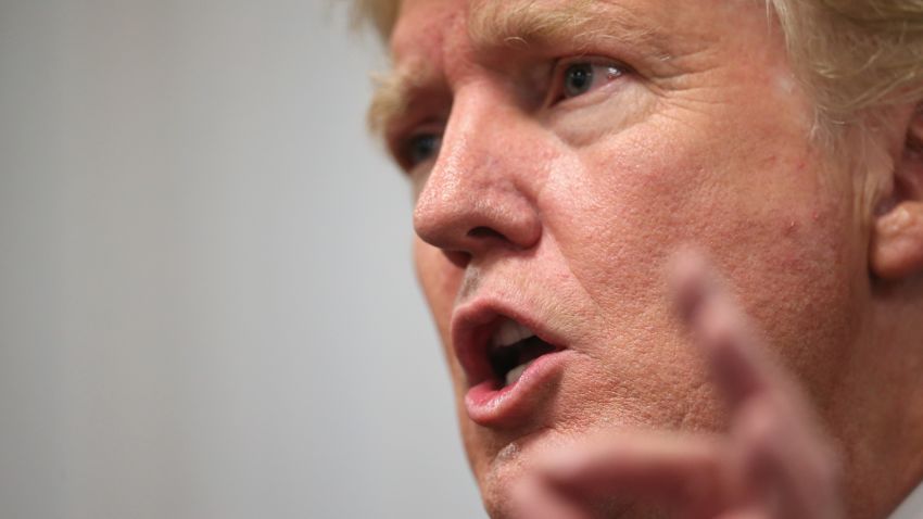 Republican presidential hopeful businessman Donald Trump speaks to the press following a rally on July 25, 2015 in Oskaloosa, Iowa.
