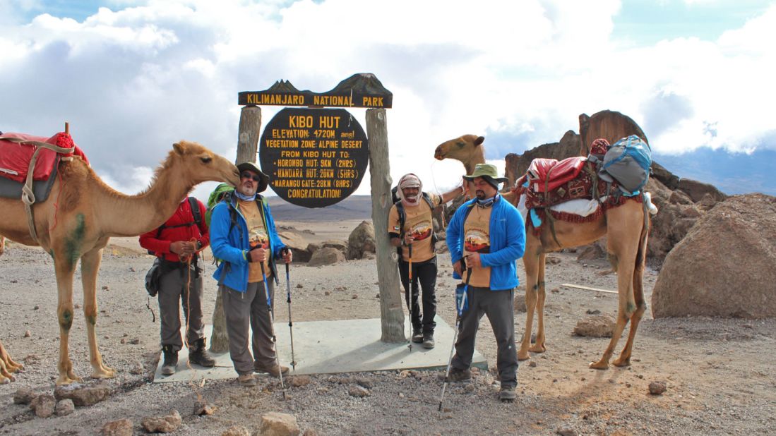 "When we reached the top we didn't celebrate too much as we knew going back wouldn't be easy because the camel has long legs," says Majrin. "With patience and the expertise of local guides and porters, the Emirates team made it up and back to the park entrance with no casualties."