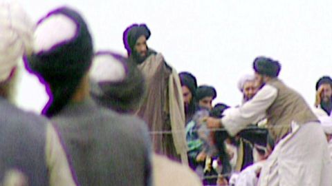 In this image taken off television by BBC Newsnight shows Taliban's one-eyed spiritual leader Mullah Mohammed Omar, center, during a rally with his troops in Kandahar before their victorious assault on Kabul in 1996. 