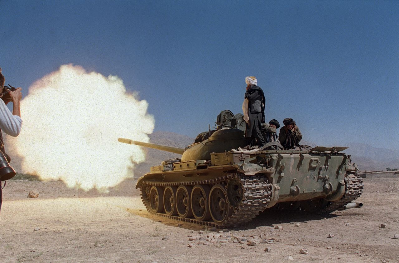 Taliban soldiers in Russian-made tanks fire on the forces of former Afghan defense minister Ahmad Shah Massood in October 1996.