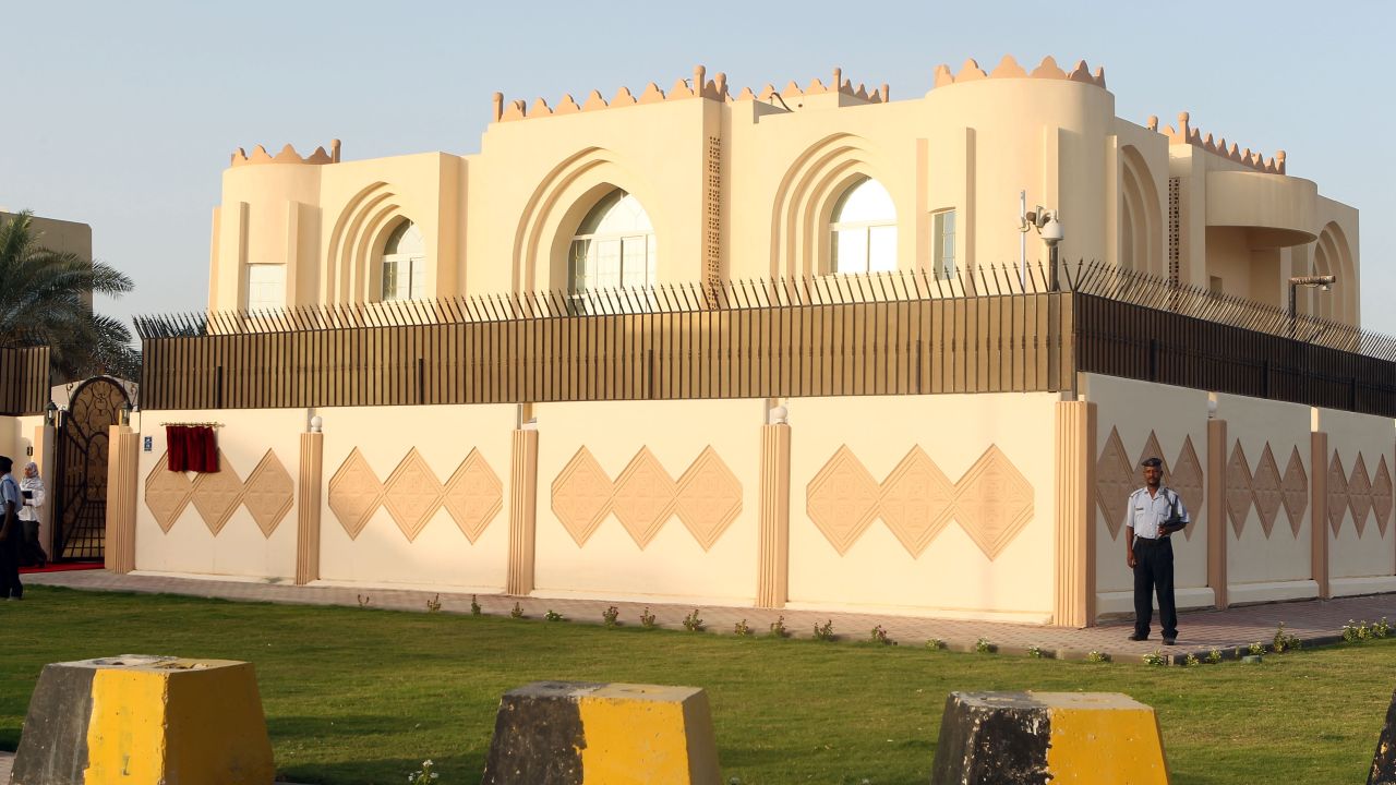 Security guards stand outside the new Taliban political office in Doha, Qatar, before its official opening in June 2013. The Taliban announced that they hoped to improve relations with other countries, head toward a peaceful solution to the Afghanistan occupation and establish an independent Islamic system in the country.