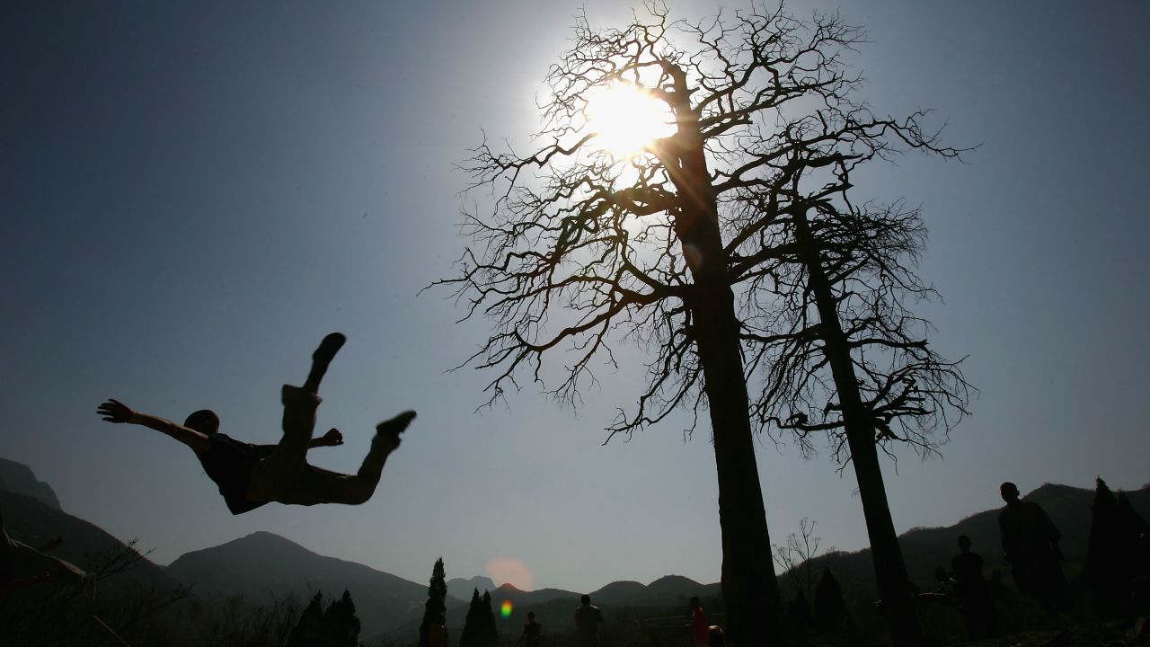 Warrior monks of Shaolin practice Kung Fu skills during a training session at the temple in 2005.