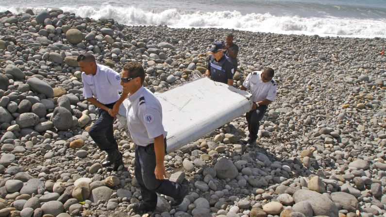 French police officers carry a piece of plane debris <a href="http://www.cnn.com/2015/07/30/world/gallery/debris-found-reunion-island/index.html" target="_blank">that was found on Reunion,</a> a remote island in the Indian Ocean, on Wednesday, July 29. An international team of aviation experts <a href="http://www.cnn.com/2015/07/30/world/mh370-debris-investigation/index.html" target="_blank">is trying to determine</a> whether the airplane part came from <a href="http://www.cnn.com/2014/03/07/asia/gallery/malaysia-airliner/index.html" target="_blank">Malaysia Airlines Flight 370</a>, which disappeared in March 2014 with 239 people on board.