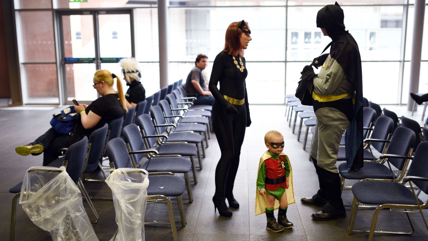 Conor and Natasha Lindop are dressed as Batman and Catwoman while their 2-year-old son, Dylan, is dressed as Robin at the MCM Comic Con in Manchester, England, on Sunday, July 26.