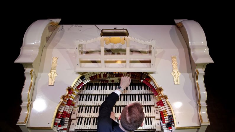 Richard Hill plays a newly restored Wurlitzer Theatre Pipe Organ, believed to be the largest in Europe, at the Troxy entertainment venue in London on Wednesday, July 29. The Wurlitzer has more than 1,728 pipes to go with four keyboards, one pedal board and 241 stop keys.