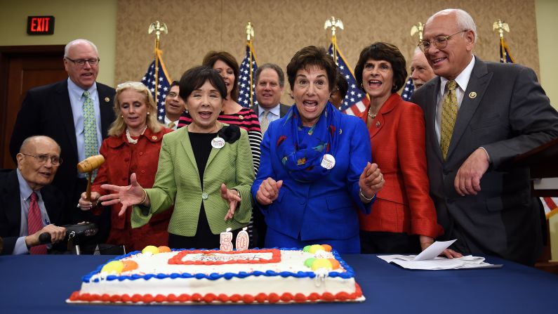 Current and former members of the U.S. Congress celebrate the 50th anniversary of Medicare and Medicaid with a special cake Wednesday, July 29, in Washington. During the event on Capitol Hill, they promised they would fight any proposed cuts to the programs.