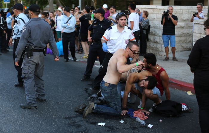 A stabbing victim receives assistance at a gay pride parade in Jerusalem after police say an Orthodox Jew stabbed six people Thursday, July 30.  Two of the victims were injured seriously, Israeli police spokeswoman Luba Samri said. The suspect, Yishai Shlissel, was recently released from prison for committing a similar crime 10 years ago.