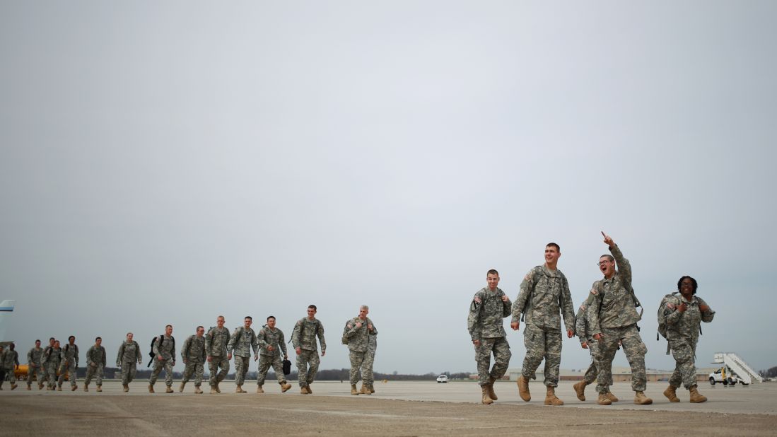 Soldiers from the U.S. Army's 101st Airborne Division walk across the tarmac at Campbell Army Airfield before reuniting with their families at a homecoming ceremony March 21, 2015 in Fort Campbell, Kentucky. The 162 soldiers were deployed in Liberia, where they helped fight the spread of Ebola.