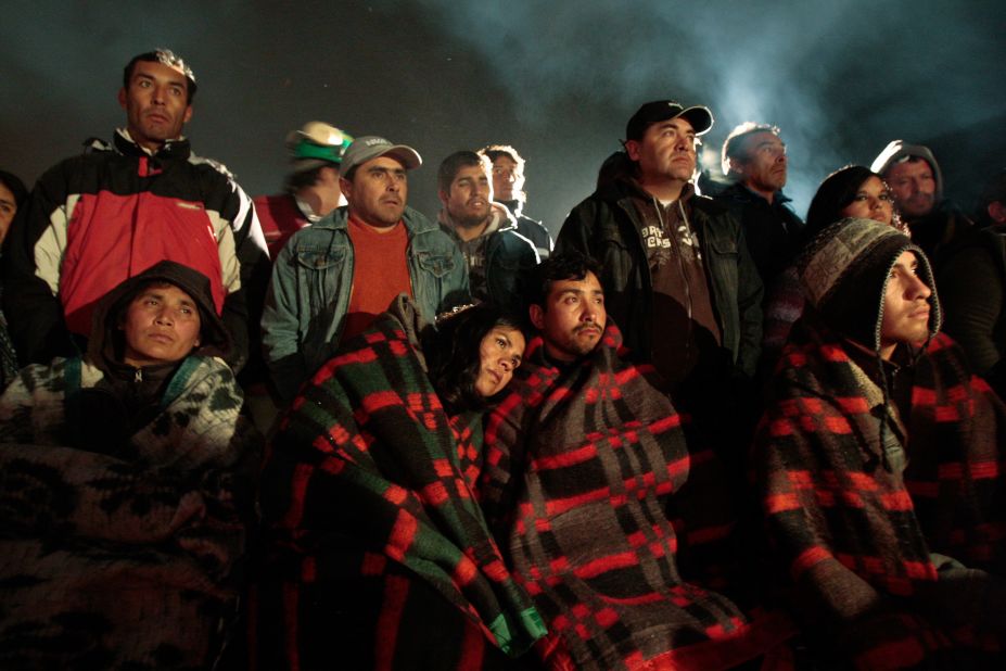 Relatives stand by as rescuers work to free 33 miners trapped inside the San Jose mine near Copiapo, Chile, on August 6, 2010. The mine collapsed a day earlier, and the miners ended up trapped 2,300 feet underground for more than two months. See how the rescue operation unfolded.