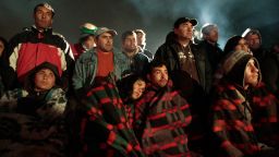Relatives wait as rescuers scramble to dig out 34 copper workers trapped inside the San Jose mine in Copiapo, northern Chile, Friday, Aug. 6, 2010. Miners are  trapped  nearly 1,000 feet (300 meters) below ground after a tunnel caved in. (AP Photo/Luis Hidalgo)