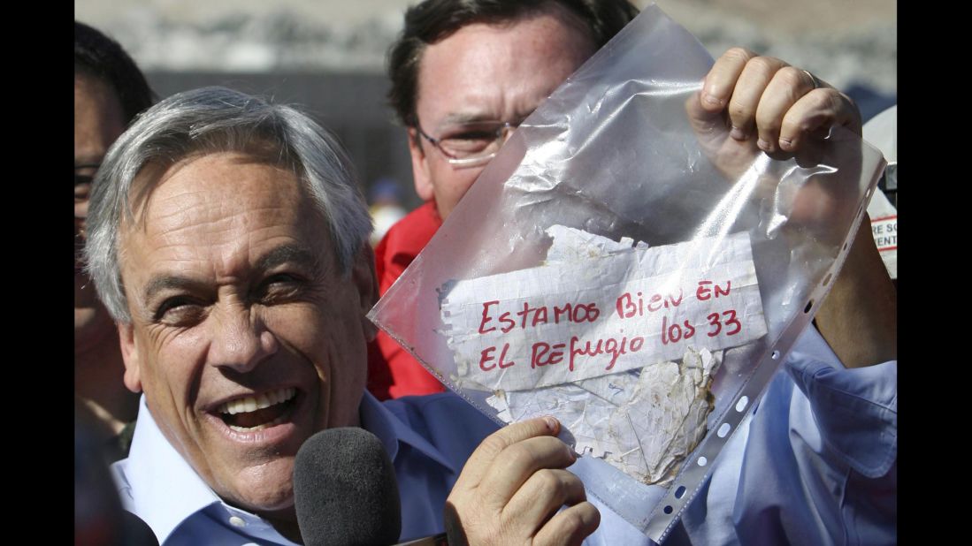 Chilean President Sebastian Pinera holds up a plastic bag containing a message from the miners on August 22. Translated from Spanish, it read: "We are OK in the refuge, the 33." The miners were confirmed to be alive when rescue teams reached them via a tube that was sent down a small hole. The same hole was used to provide the miners with food, supplies and letters.