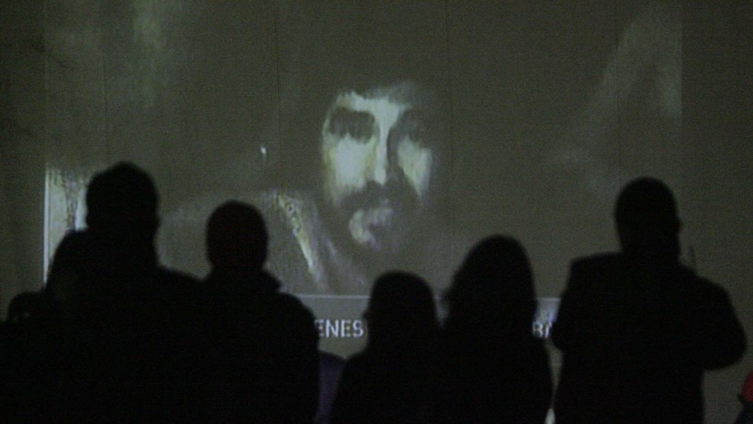 Relatives watch a video of the trapped miners on August 26. Chilean television aired footage of the miners, showing them in good spirits and explaining how their underground shelter was set up.