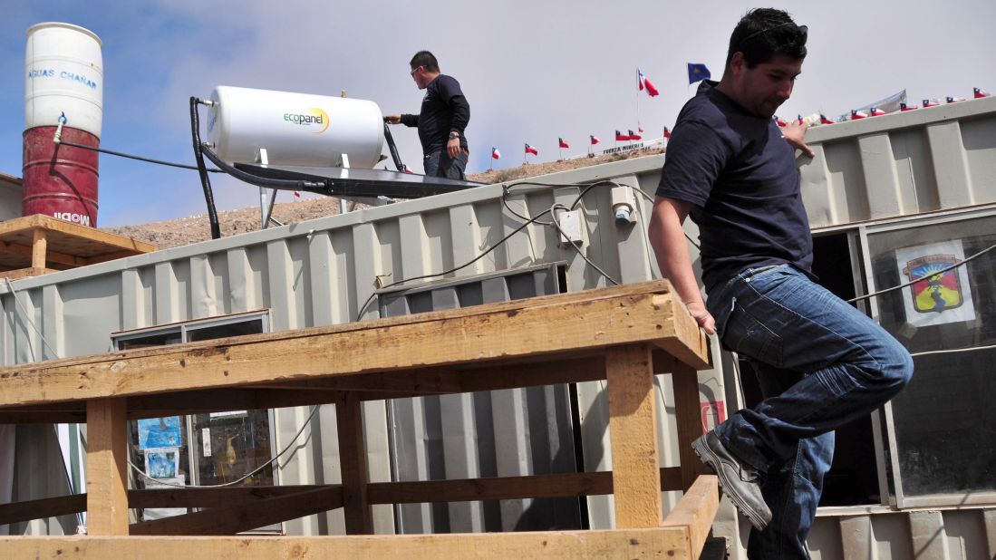 On September 8, volunteers install heating and water purification systems at the La Esperanza tent city that sprang up outside the mine as news of the collapse spread. Esperanza means hope in English.