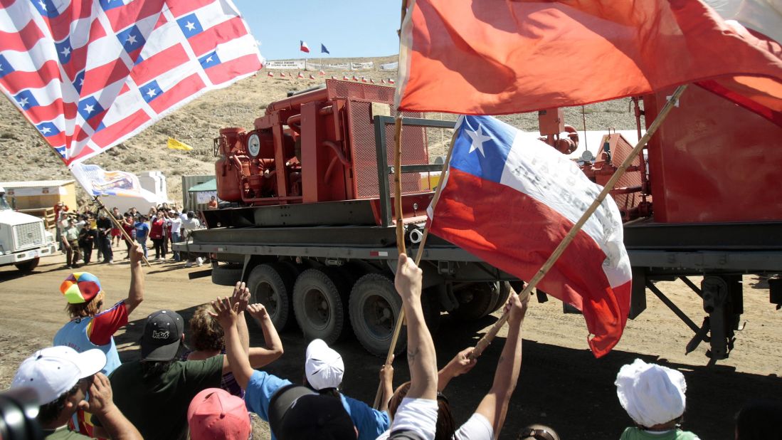 People celebrate the arrival of part of an oil rig on September 16. Soon, an escape route would be drilled for the trapped miners.