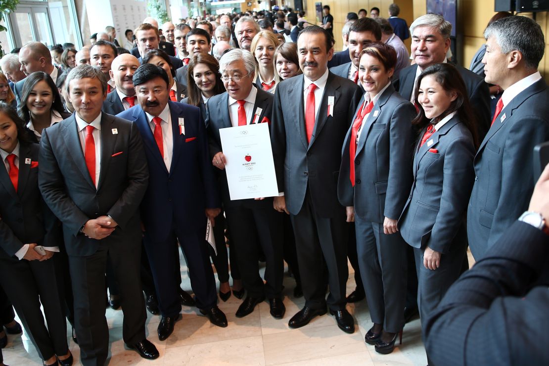Kazakhstan's Prime Minister, Minister of Foreign Affairs, and President of the National Olympic Committee are pictured with bid committee members presenting their bid.