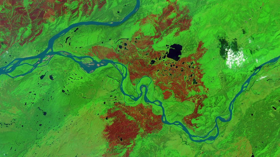 Alaska's Interagency Coordination Center said that 4,748,841 acres in the state had burned in wildfires by July 30. That acreage is enough to make 2015 fourth on the list of years with the most area burned. The record was set in 2004, when 6,590,140 acres burned. The town of Tanana was hardest-hit this year, with about 496,000 acres burned -- that's an area about half the size of Rhode Island. Many of Tanana's 300 residents left in June. The Landsat 8 satellite took this false-color image of the fire-scarred area on July 24, 2015. Burned forest appears brown and unburned forest is green.