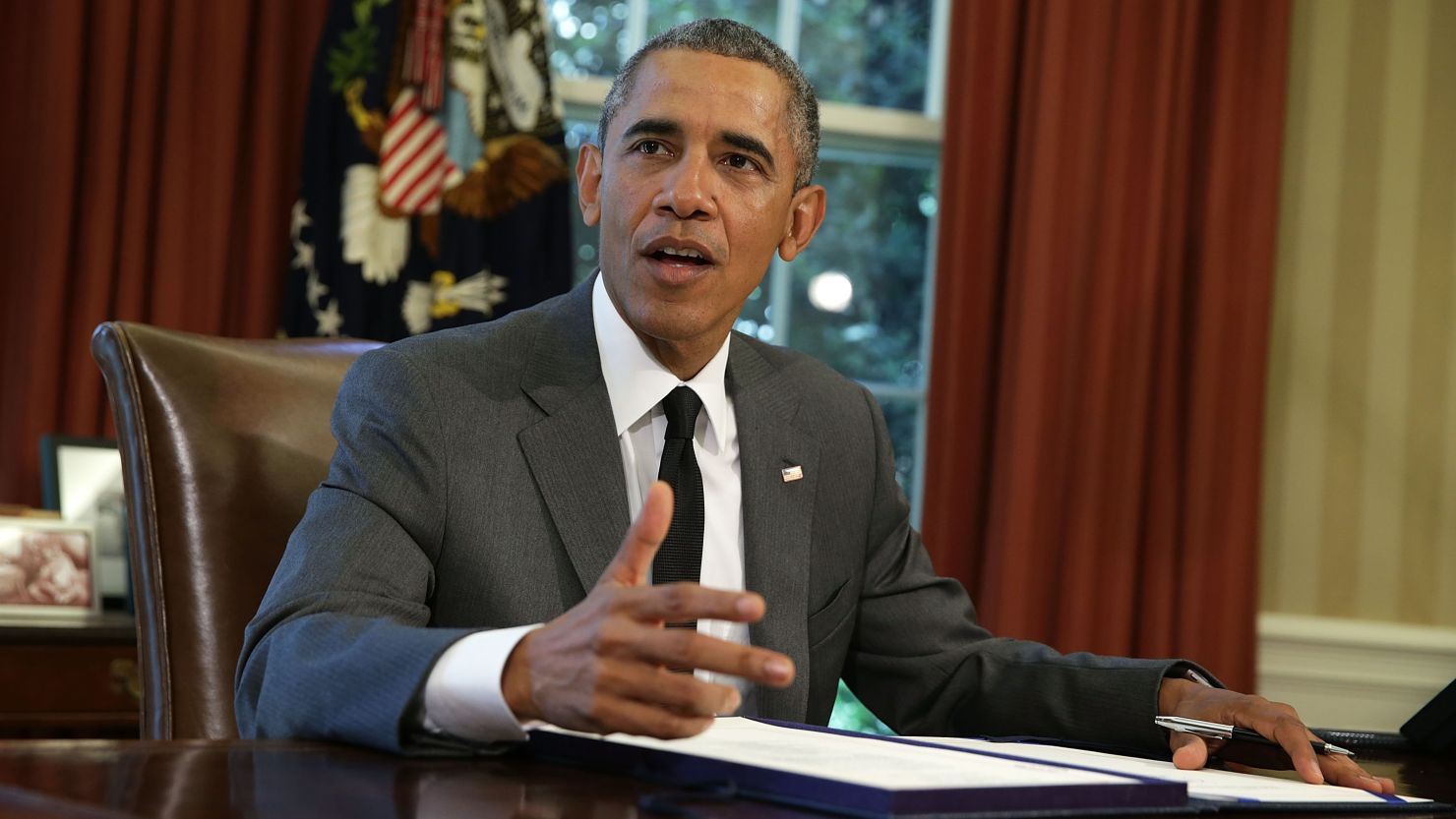 U.S. President Barack Obama speaks prior to signing the 3-month extension of the Highway bill in the Oval Office of the White House July 31, 2015 in Washington, D.C.