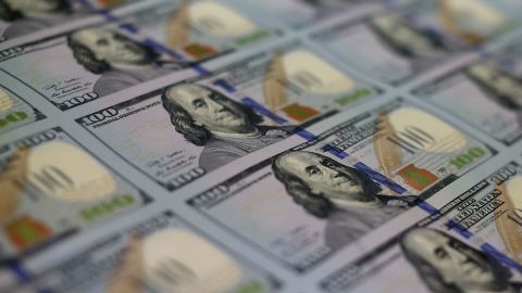 Newly redesigned $100 notes lay in stacks at the Bureau of Engraving and Printing on May 20, 2013 in Washington, D.C.