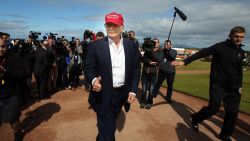 US billionaire Donald Trump (C) is pictured as he arrives at the Women's British Open Golf Championships in Turnberry, Scotland, on July 30, 2015