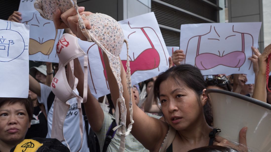 Marchers outside the Wan Chai Police Headquarters in downtown Hong Kong chanted "breasts are not weapons."