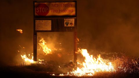 Flames from the Rocky Fire burn through dry grass August 2 near Clearlake.